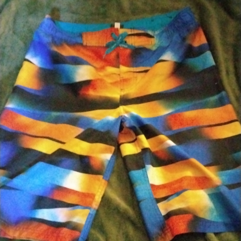 Lightly used, boys XL, colorful swim trunks